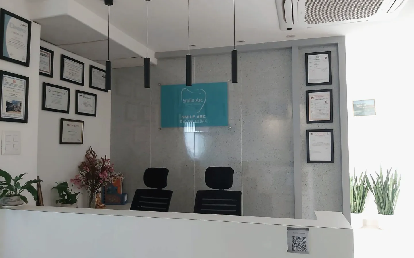 Smile Arc Dental Clinic reception with professional certificates in Lalitpur