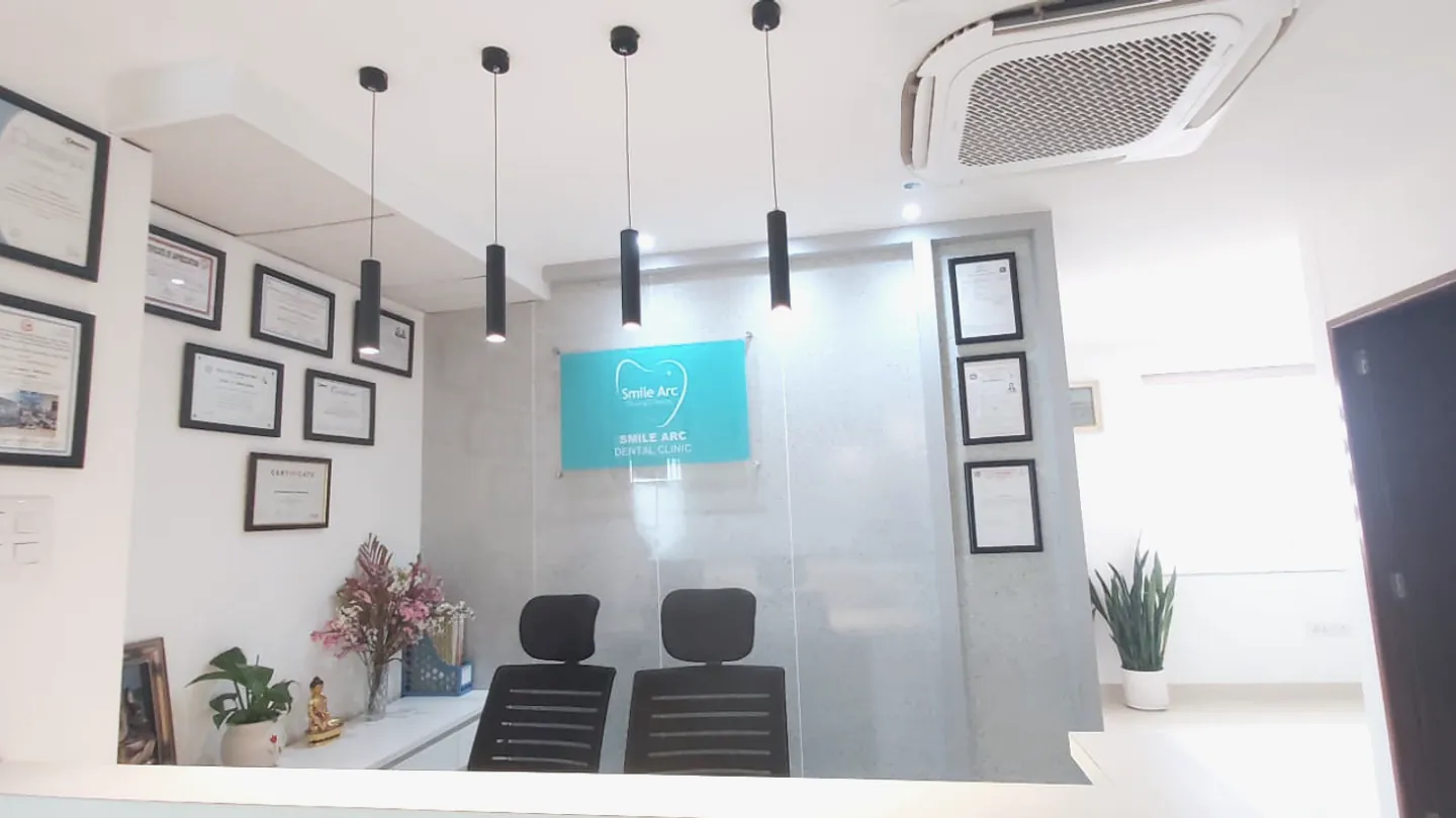 Front desk and certificate wall at Smile Arc Dental Clinic in Lalitpur